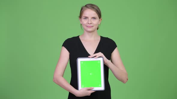 Young Happy Businesswoman Showing Digital Tablet