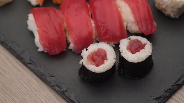 Asian food sushi maki nigiri salmon, tuna, hosomaki and uramaki. Japanese traditional food.