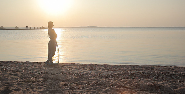 Young Woman Looking Ahead On The Sea Beach