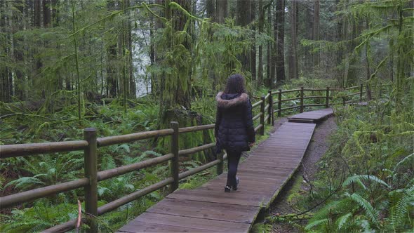 Girl Walking in the Canadian Rain Forest