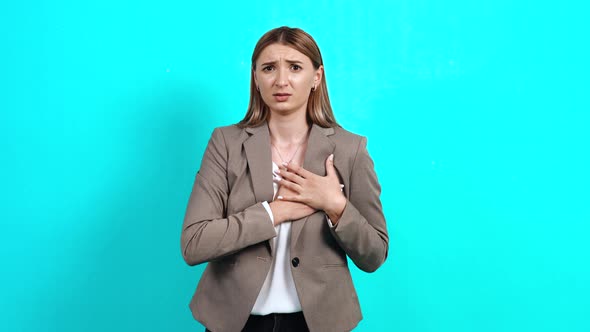 Depressed Young Woman, Worried in Business Suit, Who Feels Chest Pain Trying To Breathe