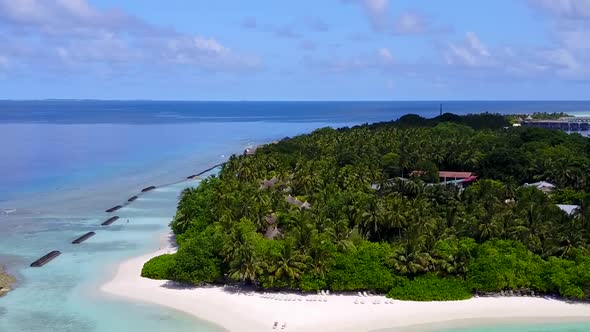 Drone aerial panorama of shore beach trip by lagoon with sand background