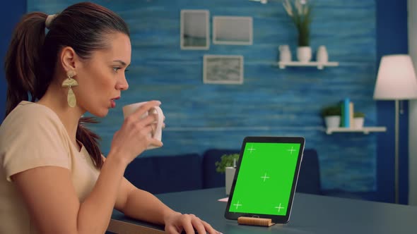 Business Woman Reading Emails While Drinking Coffee Sitting at Office Desk Table