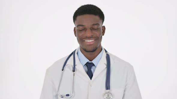 African Doctor Shaking Head As Yes Sign on White Background