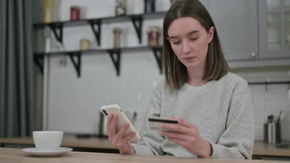 Ambitious Young Woman Making Online Payment on Smartphone 