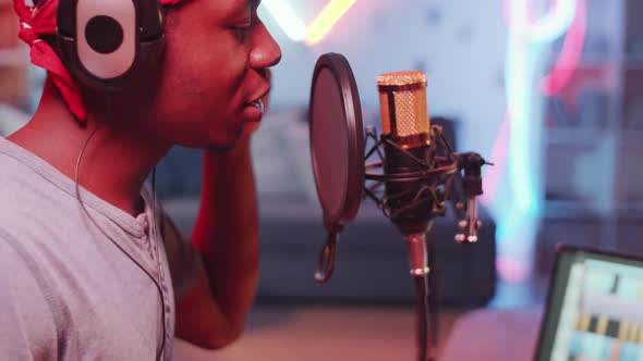 Young Black Hip-Hop Singer Recording Song in Home Studio