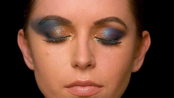 Woman With Dark Colorful Makeup