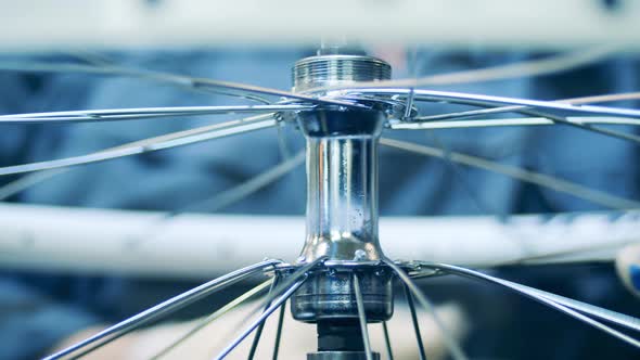 Close Up Shot of a Factory Worker Building a Bicycle Rim