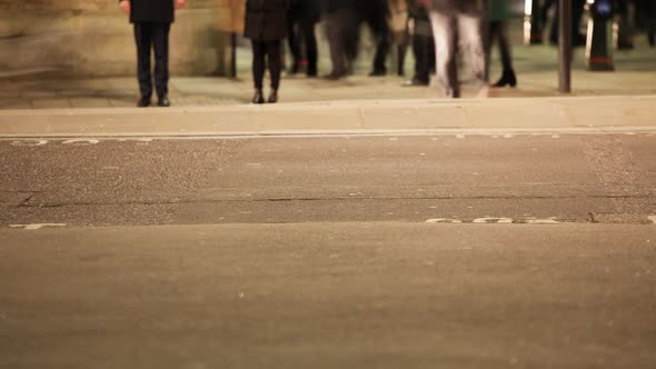 Low section of commuters crossing a road