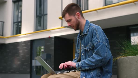 Stressed Young Caucasian Man Working Outside