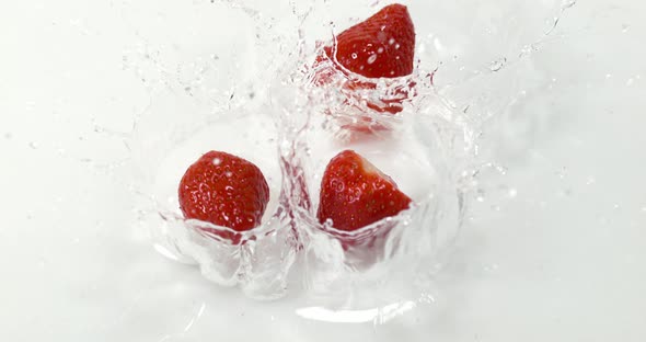 900028 Strawberries, fragaria vesca, Falling on Water, Slow Motion 4K