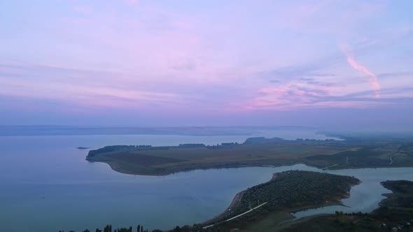 Aerial drone view of the Duruitoarea natural reservation in Moldova. River and fog in the air, hills