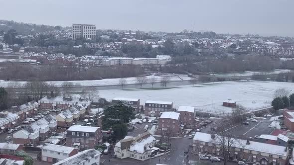 Push forward drone shot of a snowy Exeter looking towards the River Exe CROP