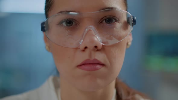 Chemist Woman Looking at Camera in Science Laboratory