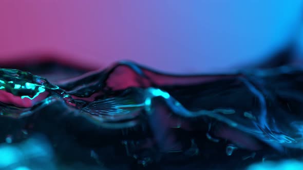 Super Slow Motion Abstract Shot of Swirling Neon Water at 1000Fps.