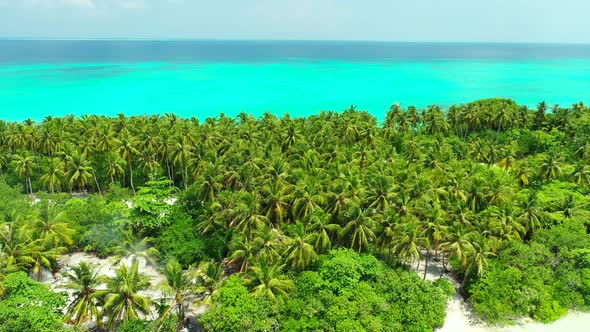 Beautiful overhead abstract view of a sunshine white sandy paradise beach and aqua blue ocean backgr