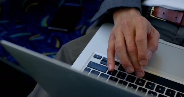 Commuter using laptop while travelling in bus 4k