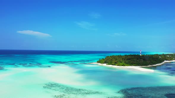 Daytime flying island view of a sunshine white sandy paradise beach and blue sea background in 4K