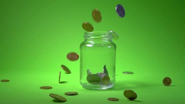 Falling Coins on Green Background.