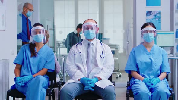 Team of Medical Staff with Protection Mask and Visor