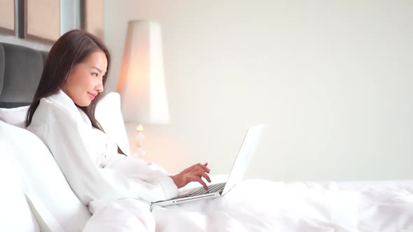 Young asian woman use laptop