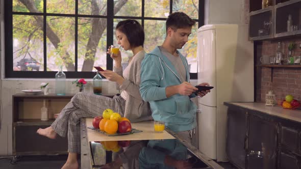 Lady and Man Using Gadgets in Flat.