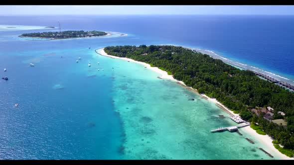 Aerial drone view seascape of paradise shore beach voyage by aqua blue ocean and white sandy backgro