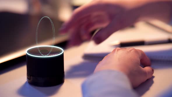 Businesswoman Using Smart Speaker at Office