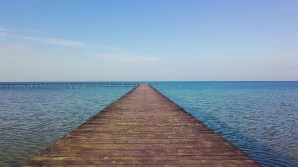 A Flight Over a Wooden Pier in the Sea