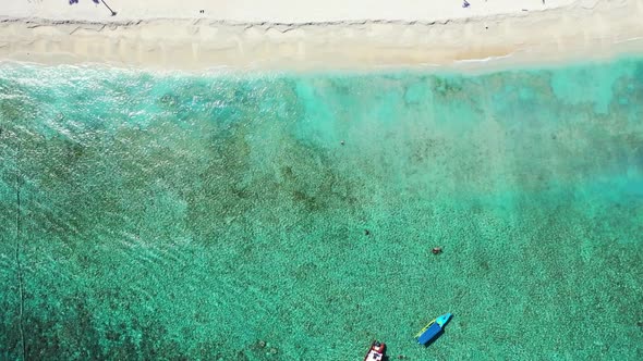 Aerial top down abstract of paradise shore beach adventure by turquoise ocean and clean sandy backgr