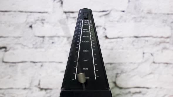 Antique Metronome with Pendulum in Slow Motion
