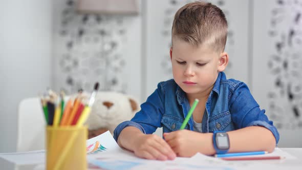 Confident Talented Cute Little Boy Drawing Picture Using Colorful Pencil Medium Closeup