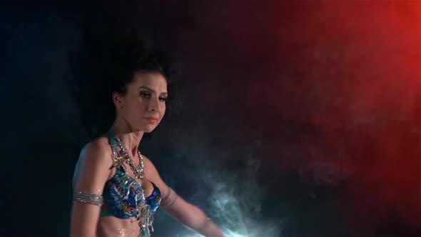 Slim, Beautiful Woman Belly Dancer Sensetive Dancing on Blue, Red, in Smoke, Slow Motion, Close Up
