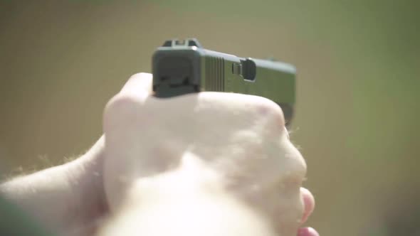 Close-up Shot of a Pistol. Slow Motion.
