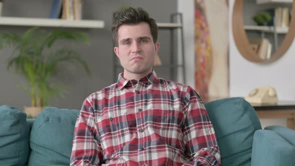 Portrait of Man Crying Towards the Camera Sofa