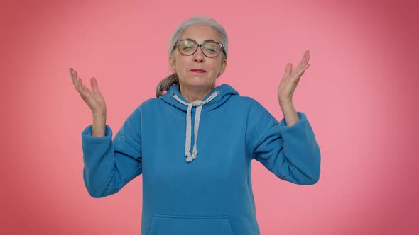 Senior Old Grandma Woman Making Playful Silly Face Expressions Grimacing Fooling Dancing