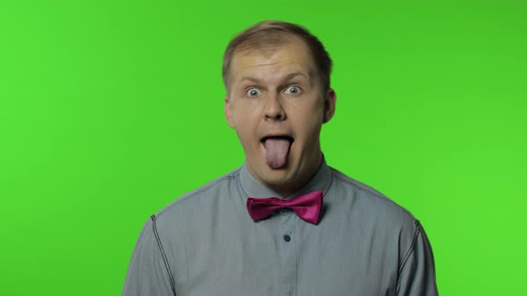 Positive Man Having Fun in Front of Camera, Showing Tongue Out, Childish Mood, Positive Emotions