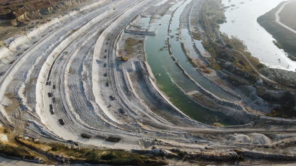 Opencast mining quarry - Aerial view. Industrial Extraction of lime, chalk, calx, caol