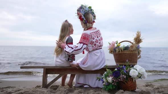 Wide Shot Loving Ukrainian Mother Hugging Charming Daughter Admiring Beauty of Nature Sitting on