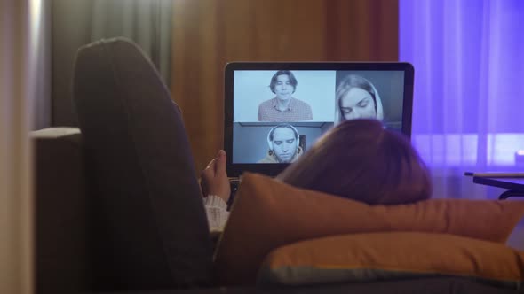 Business Woman Lying Couch Talking Her Colleagues Video Chat