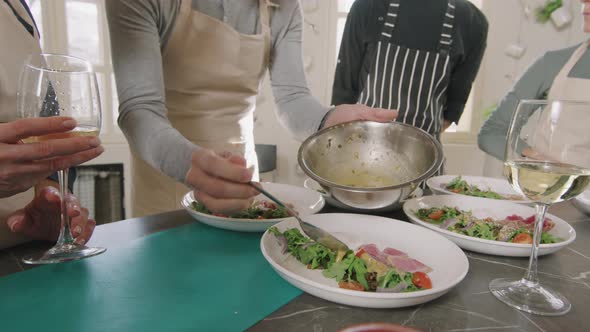 Serving Dishes At Cooking Class