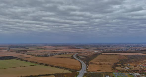 Aerial of Landscape Top View of the Asphalt Road in the Middle of Agricultural Fields