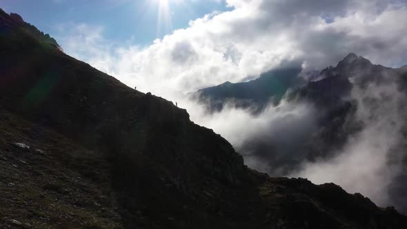 Young People Camping With Spectacular View In The Mountains