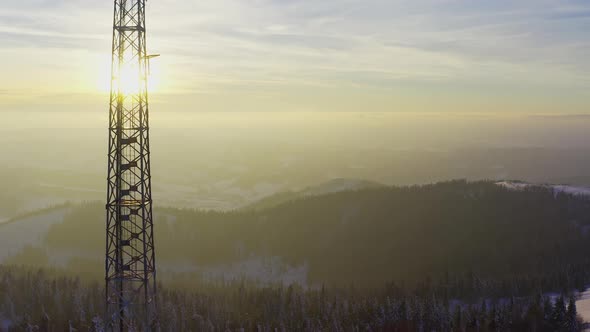 Flying Over Radio Communications Tower Mountain Snow Covered Winter Landscape