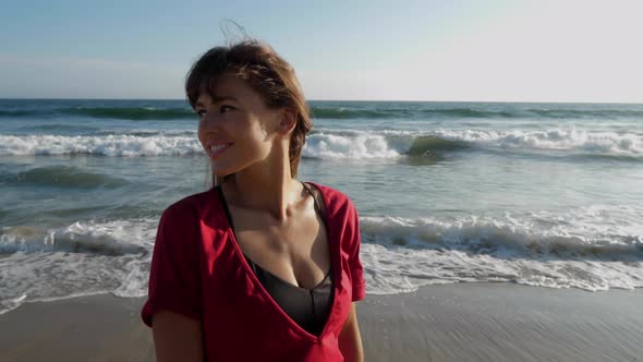 Attractive woman walking along the beach in Southern California