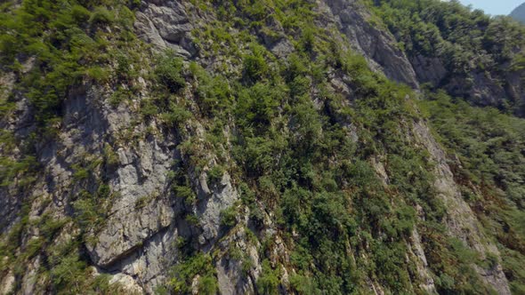 Aerial Shot Sport Fpv Drone Cliff Mountain Covered By Dense Green Trees Abkhazia Yupsharsky Canyon