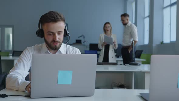 Close Up View of a Man That Sits on the Computer Screen