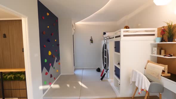 Unique Kid's Bedroom Idea With Hiking Wall and Stylish Bunk Bed