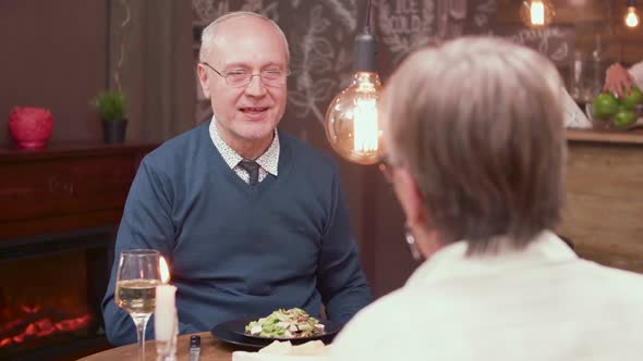 Slow Motion Portrait of a Old Man Making a Proposal To His Partner