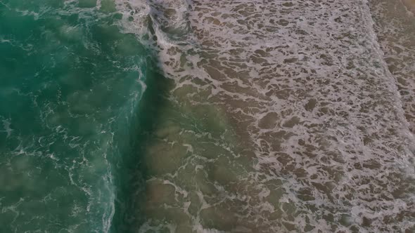 An Aerial View of Waves Crashing on Beach in Cancun